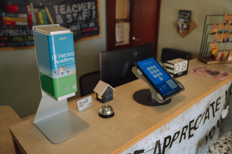 Front desk of Lil’ Patriots Academy child care center in Puyallup, welcoming families to toddler daycare and play-based toddler curriculum.