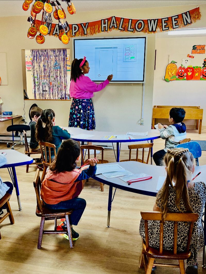 Preschool classroom activity led by a teacher at Lil’ Patriots Academy in Puyallup WA, where children engage in fun and structured early education.