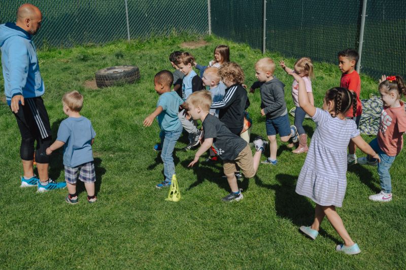 Child playing in a safe, supervised learning space near South Hill.