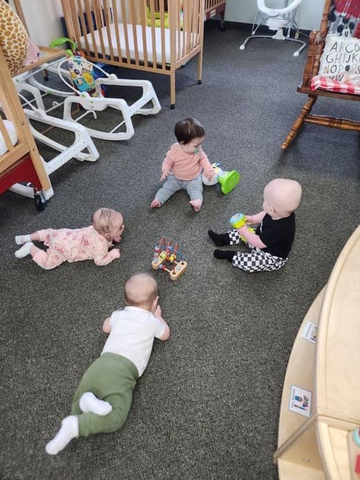 Child playing in a safe, supervised play area at Lil' Patriots Academy 176th Street campus.