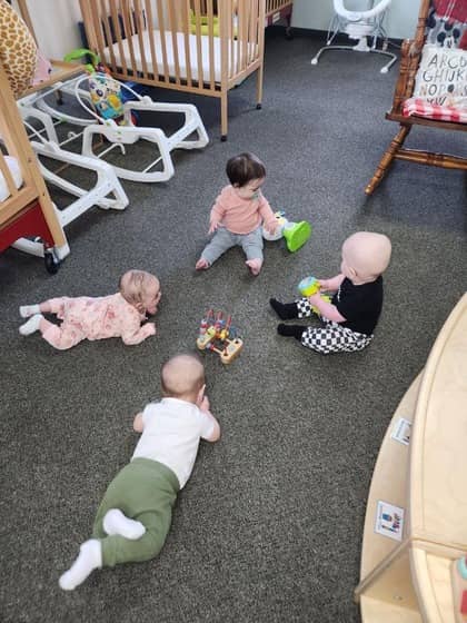 Young children collaborating on an art project at Lil Patriots Academy in Puyallup, showcasing creative learning at this daycare puyallup wa.